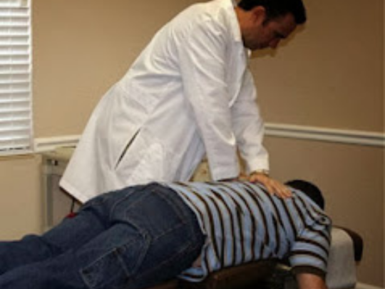 Chiropactor doctor working on back pain in florida